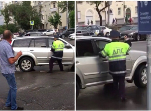 Полицейский набросился с кулаками на машину нарушителя в центре Волгограда Полицейский набросился с кулаками на машину нарушителя в центре Волгограда